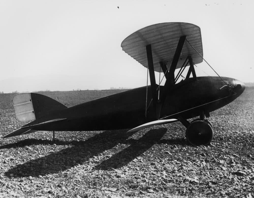 The small Loughead S-1 single-seat sport biplane on the ground, with its smooth moulded fuselage