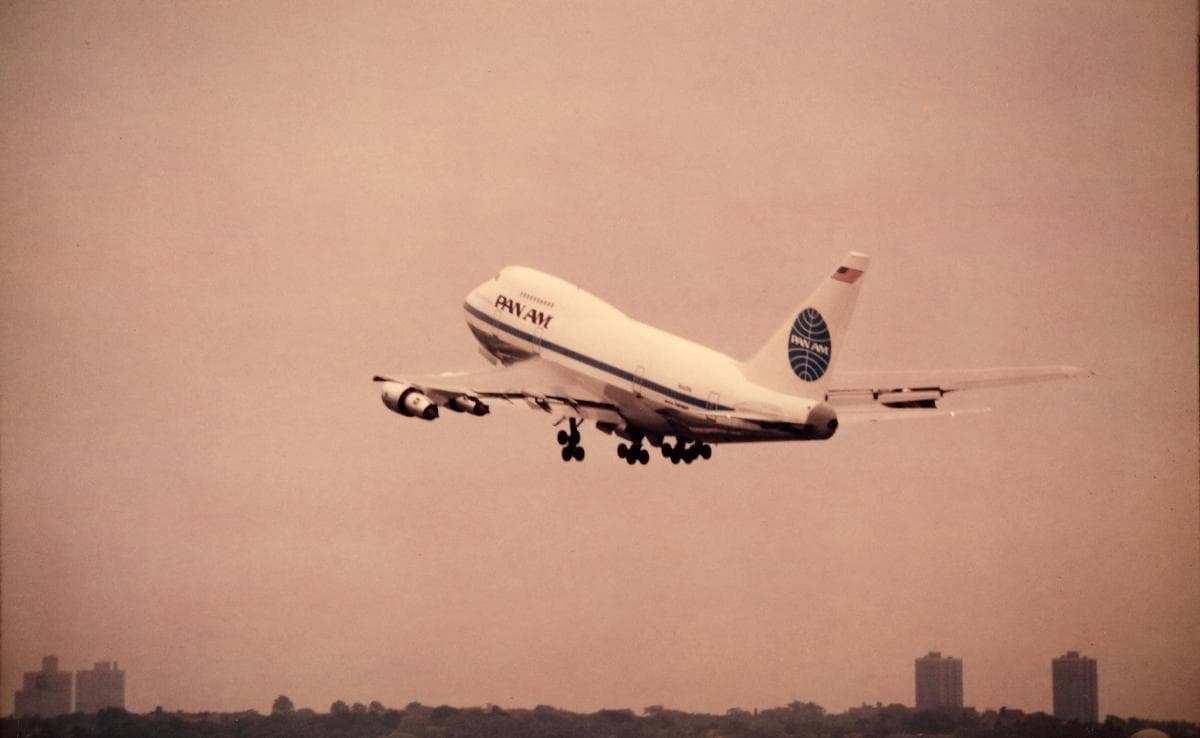 A Pan Am Boeing 747SP taking off, its noticeably shortened fuselage and tall tail distinguishing it from the standard-length 747