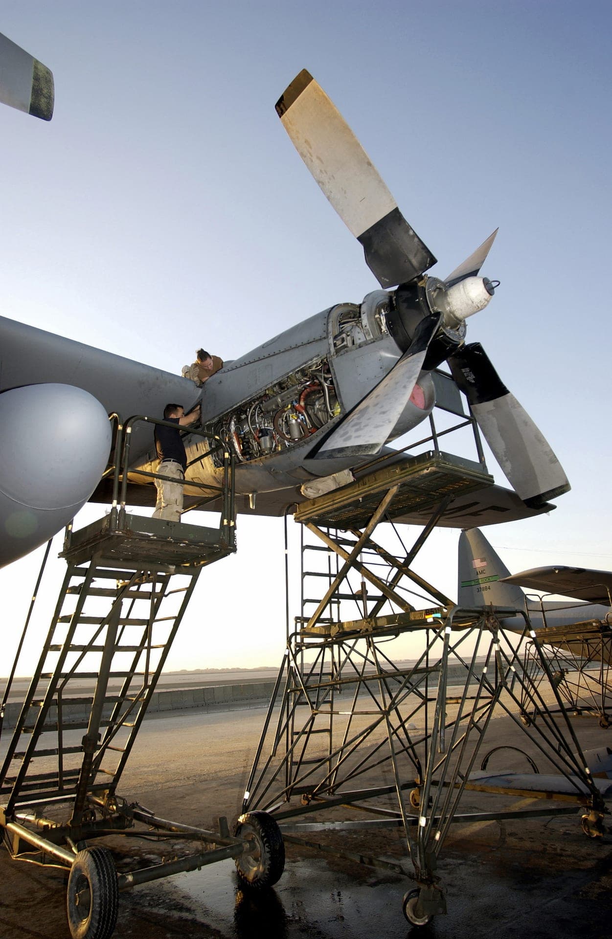 An Allison T56 turboprop engine being serviced on a C-130 in Iraq, 2003