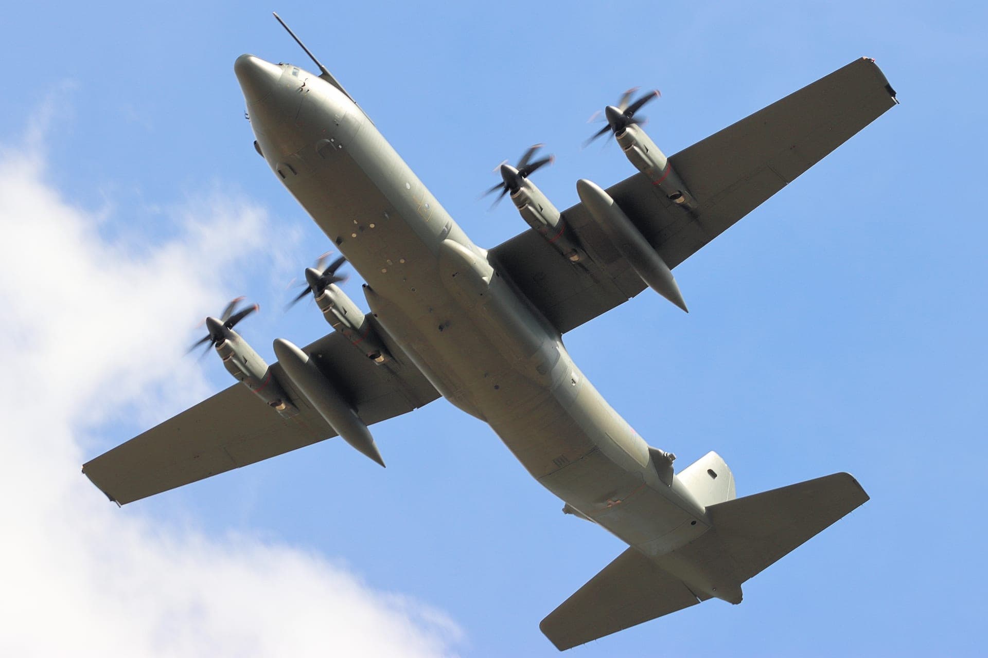 A C-130J Super Hercules in flight, its six-blade propellers distinguishing it from earlier marks