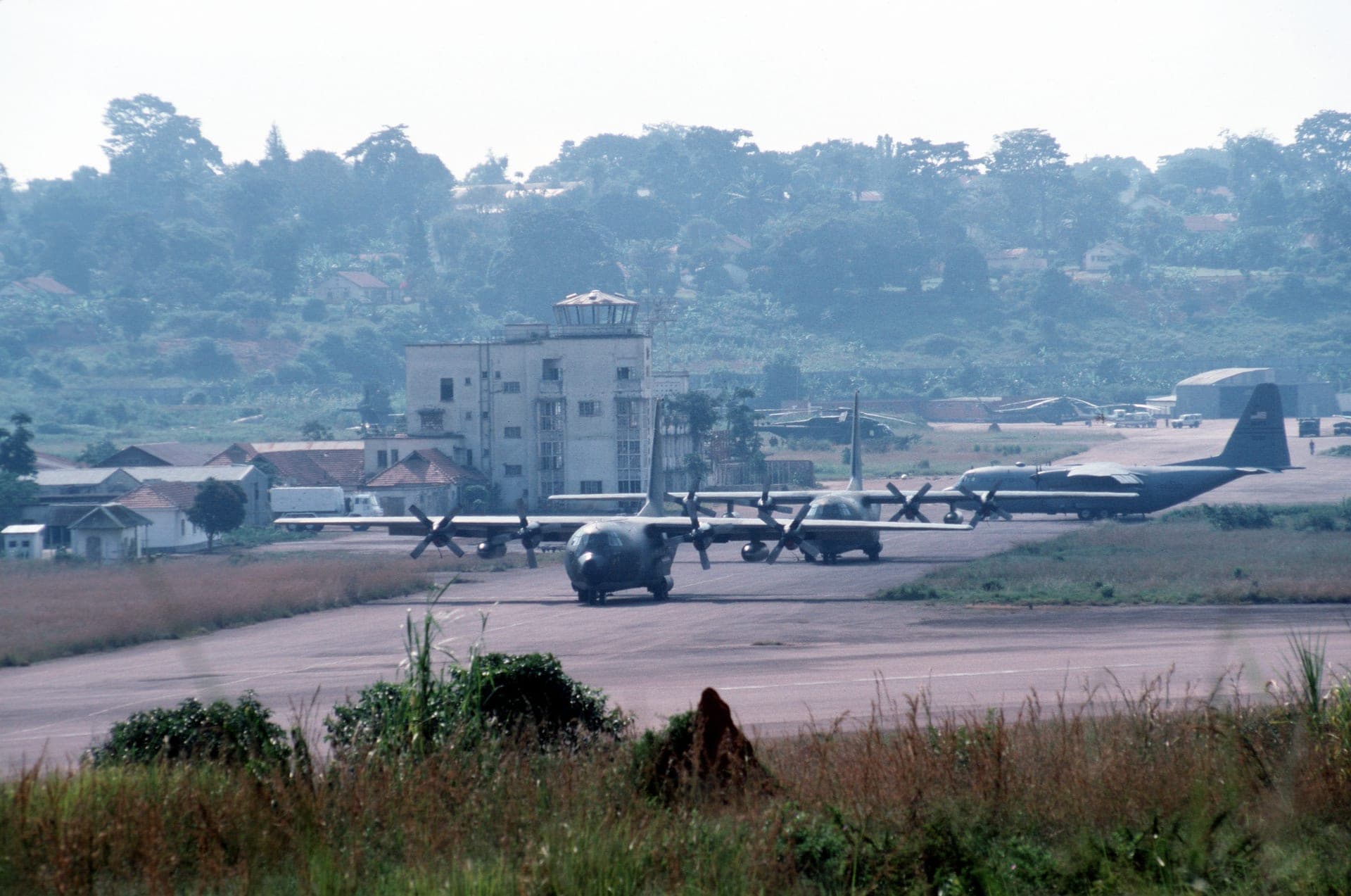 USAF C-130s parked in front of the Entebbe Airport terminal in 1994, still marked by the 1976 Israeli rescue raid
