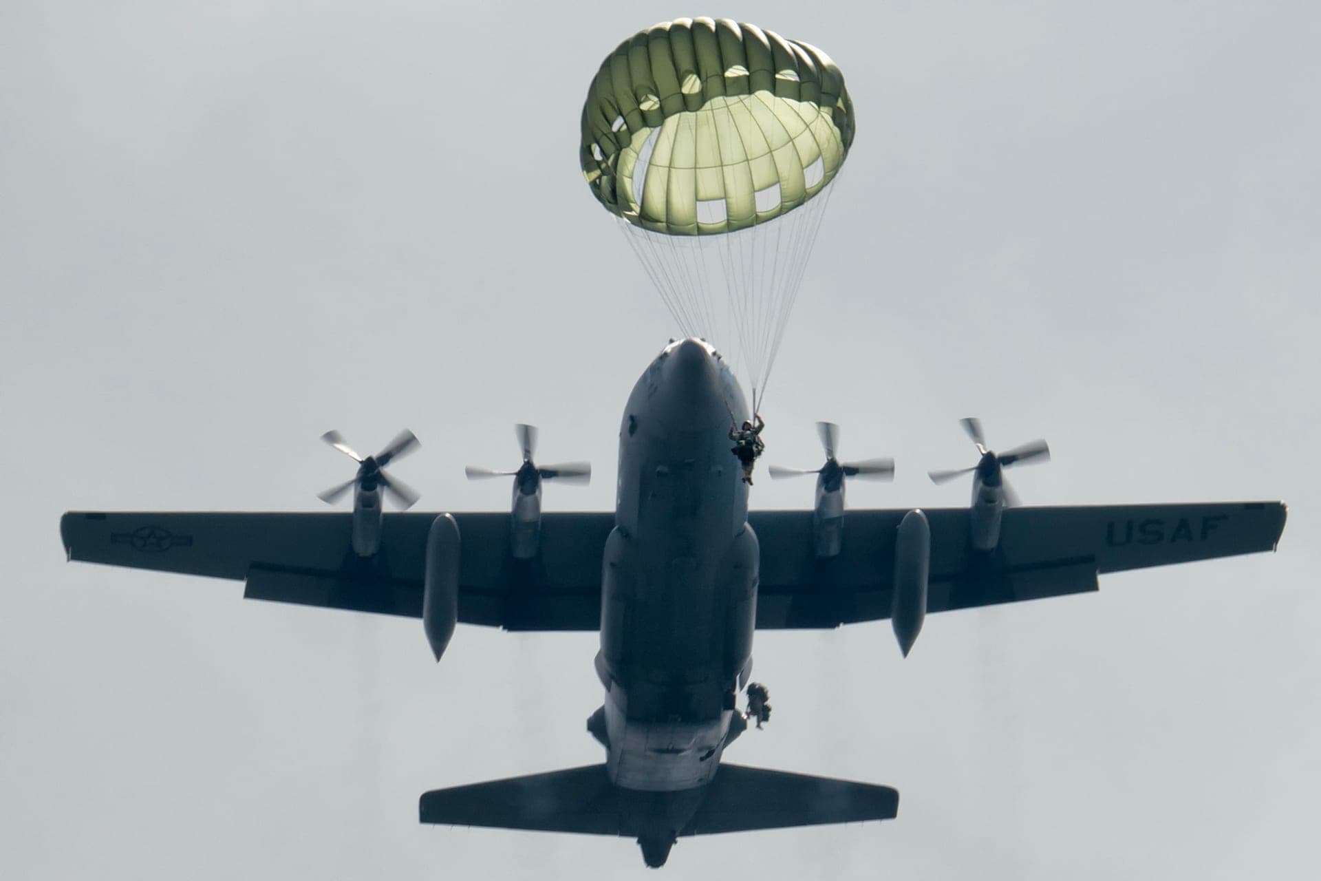 U.S. Army Special Forces soldiers jumping from a C-130 during an airborne training exercise at Camp Fuji, Japan, 2014