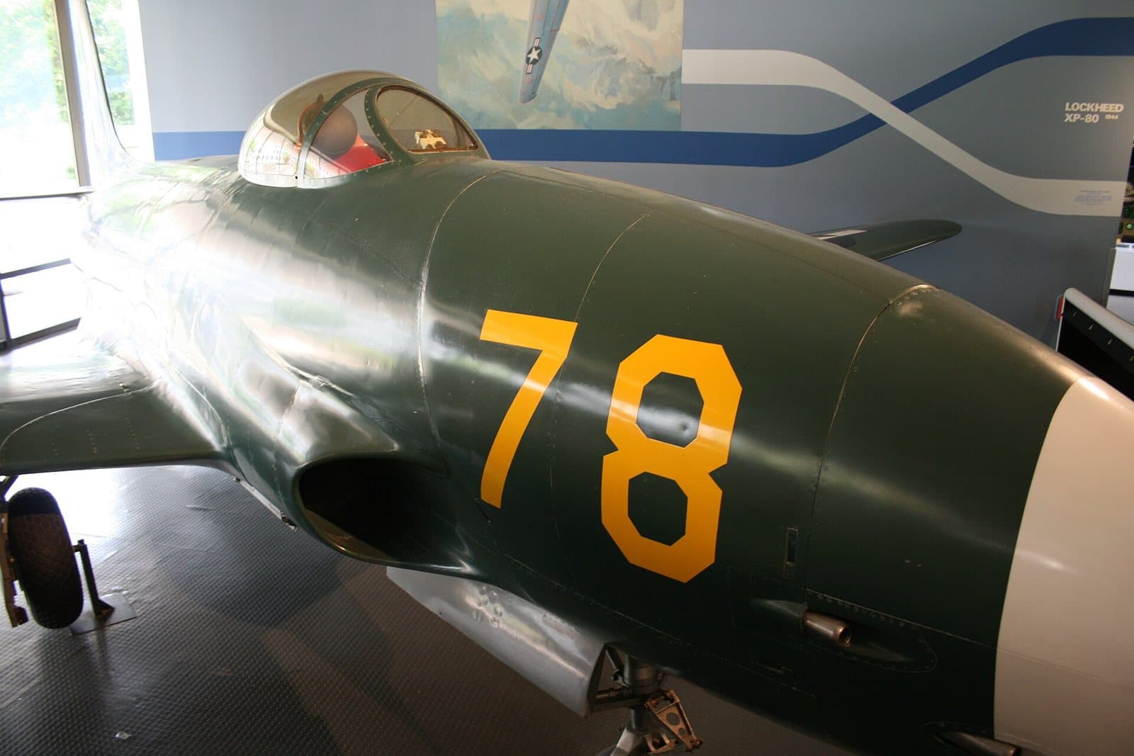 The green Lockheed XP-80 'Lulu-Belle' jet fighter prototype hanging in the National Air and Space Museum